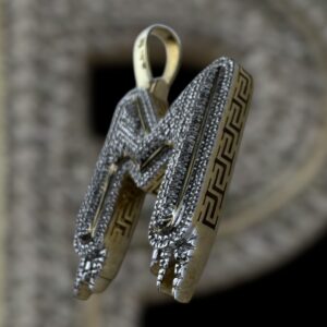 drippy “m” diamond pendant