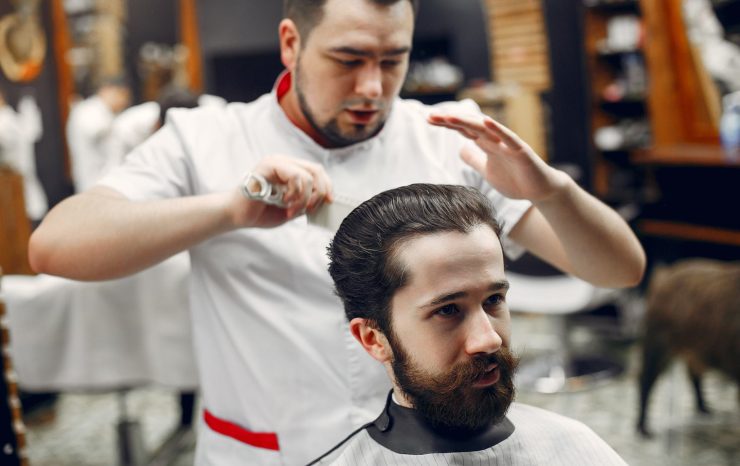 stylish-man-sitting-in-a-barbershop-N3QZCDL.jpg